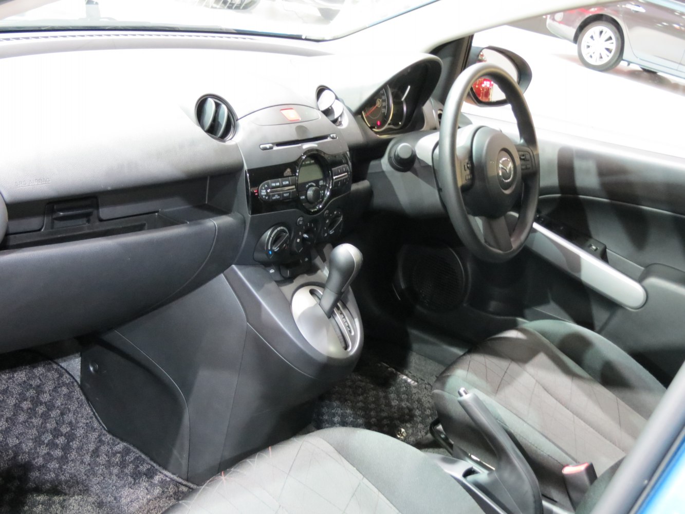 Dashboard, steering wheel, and gear shifter interior layout