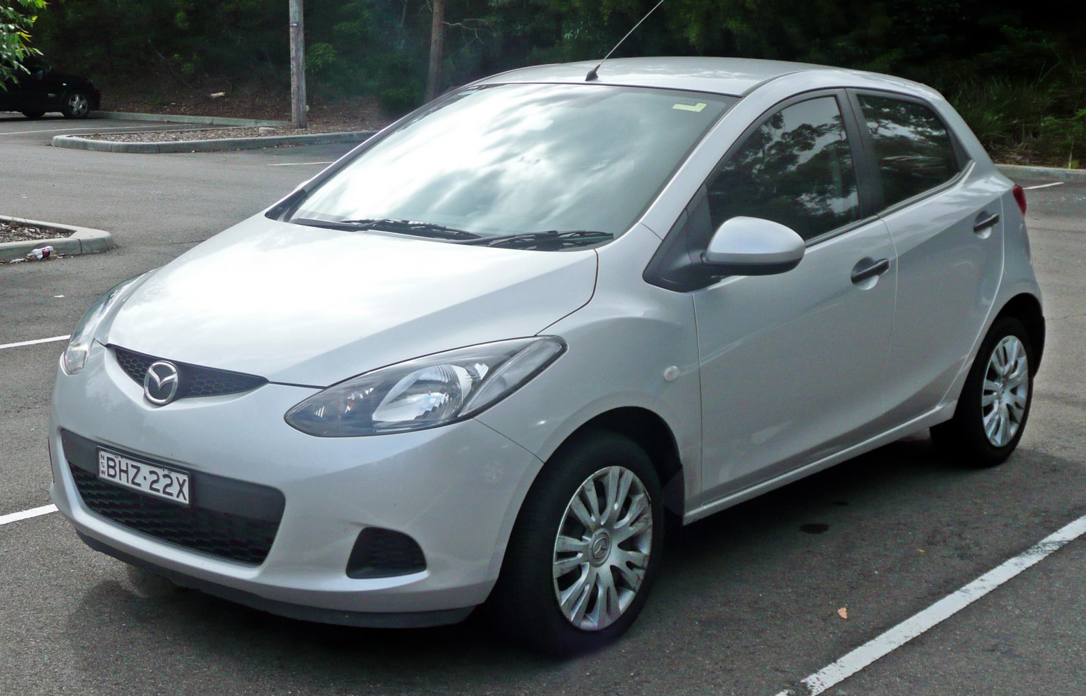 Front and side view of a compact hatchback with aerodynamic headlights
