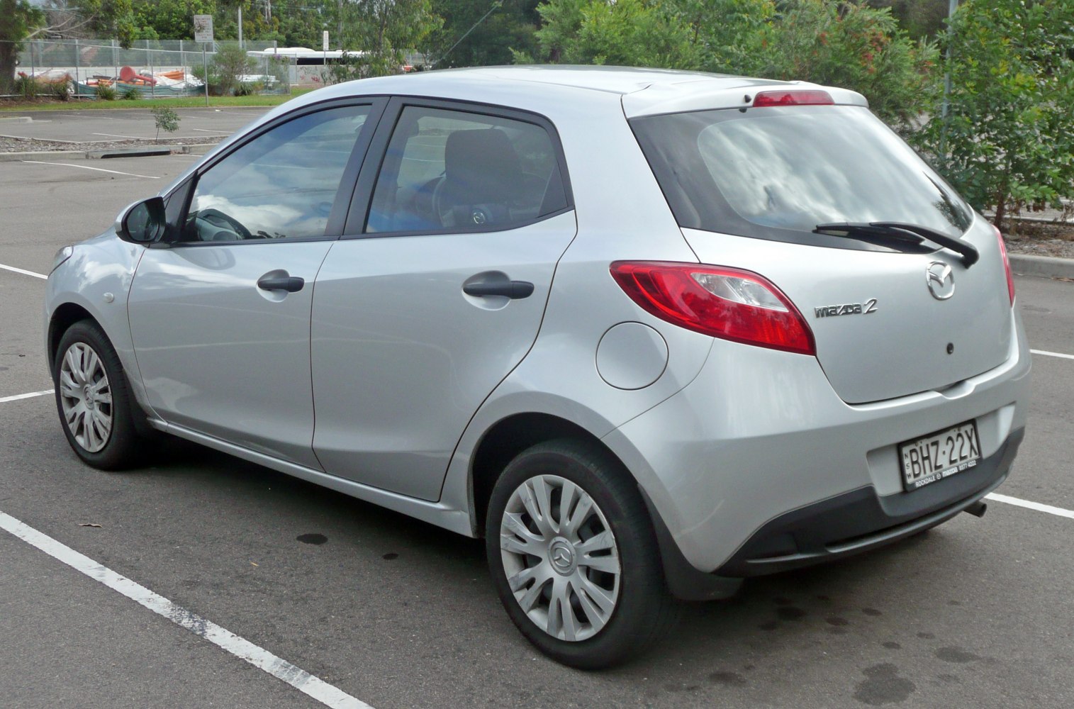 Silver five-door compact hatchback with rear wiper and distinct taillights.