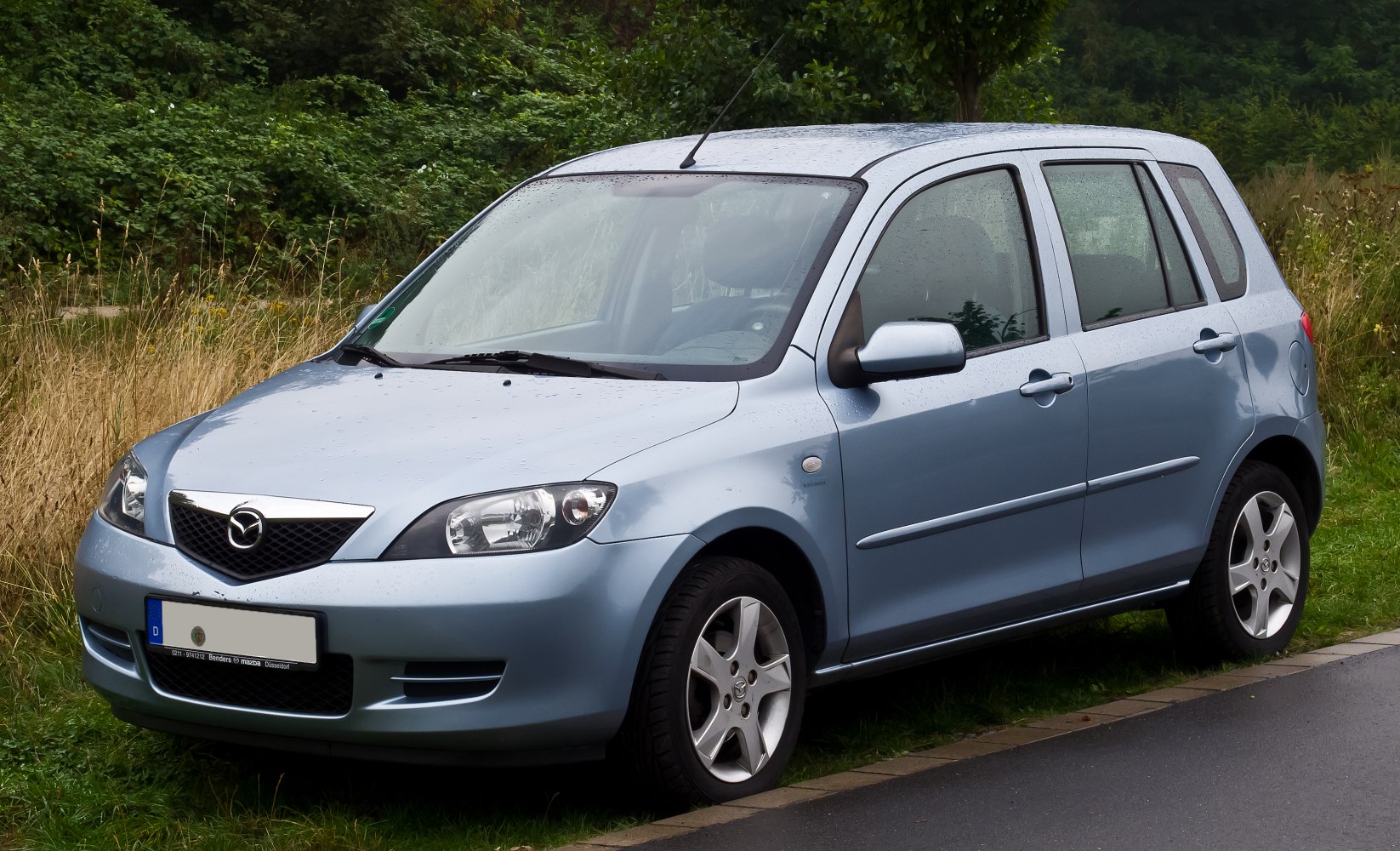 Compact hatchback front side with distinctive grille and sleek headlights