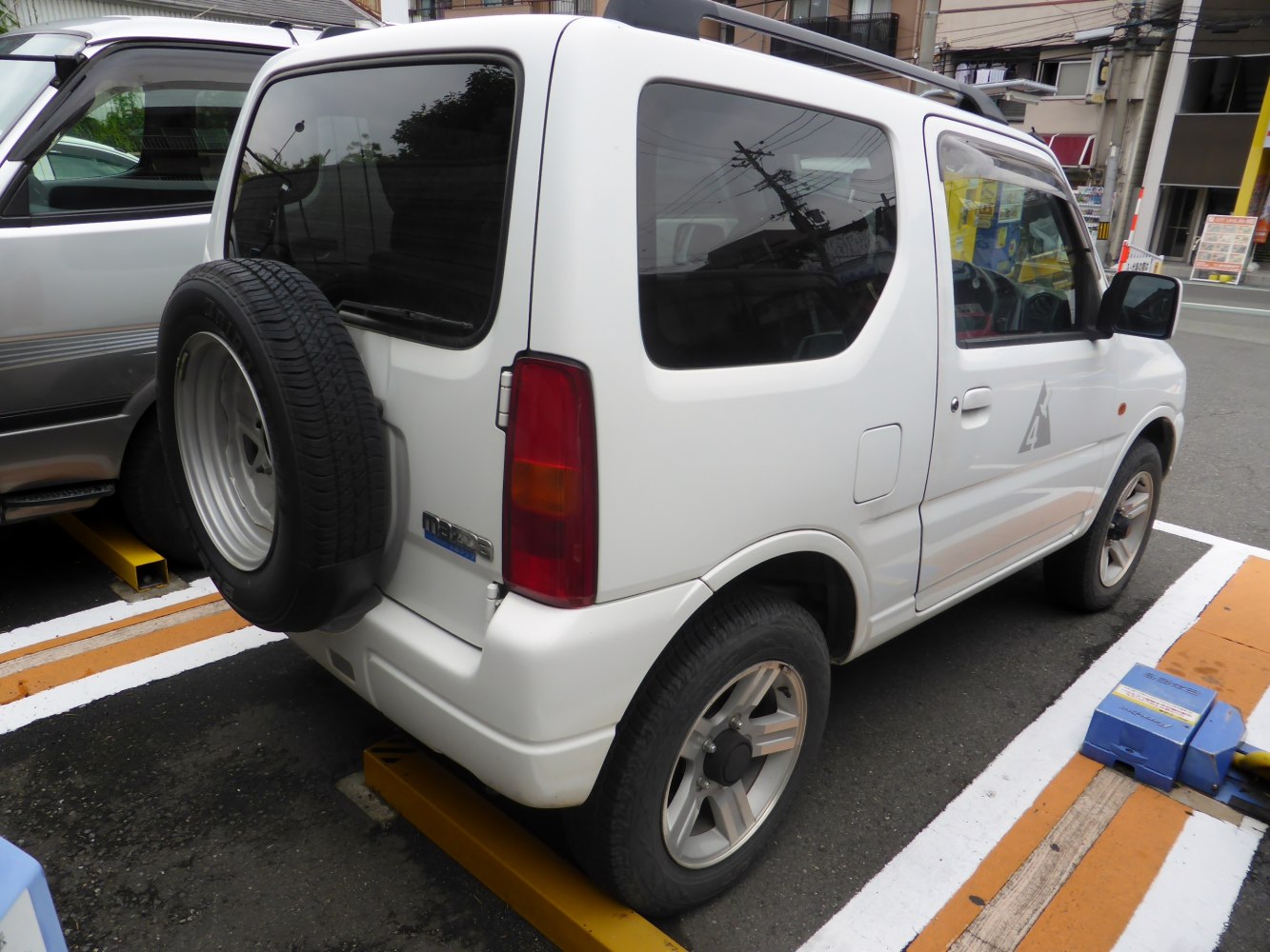 Compact SUV with rear spare tire and angular side windows