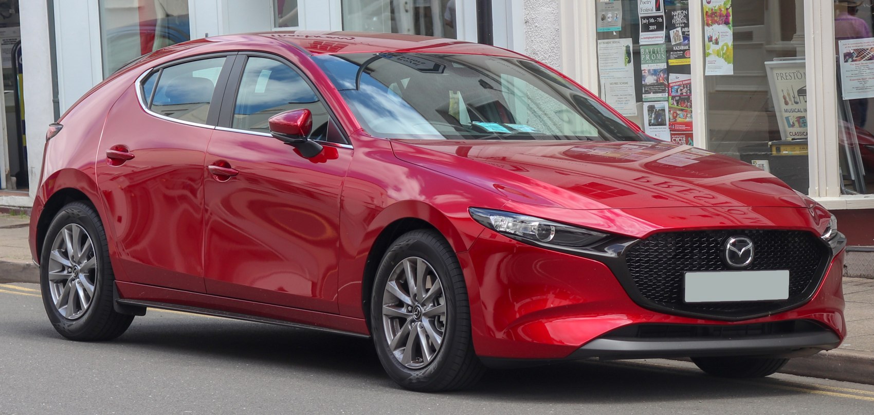 Front side view with smooth body curves and sleek headlights