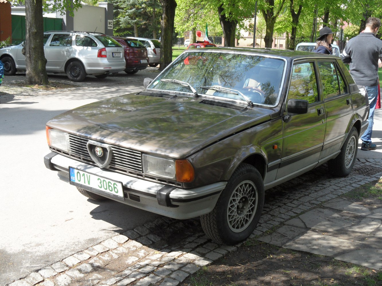 Vintage sedan with rectangular headlights and mesh alloy wheels