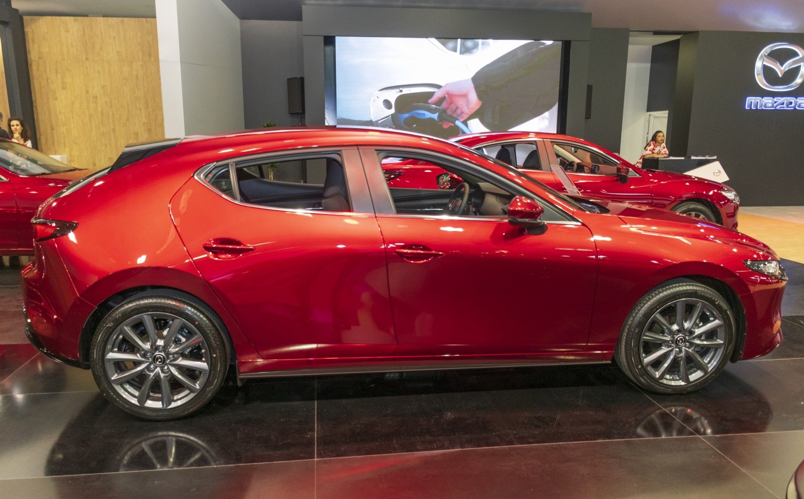 Side profile of a hatchback with alloy wheels and streamlined body