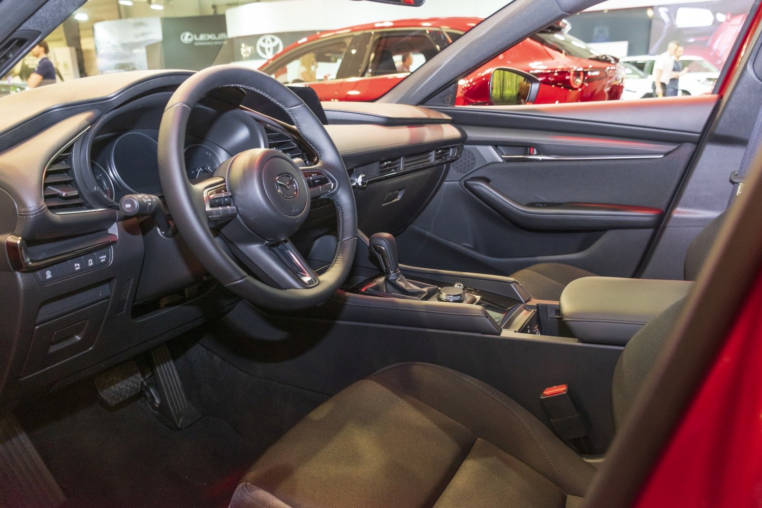 Dashboard, steering wheel, center console, and door panel interior view