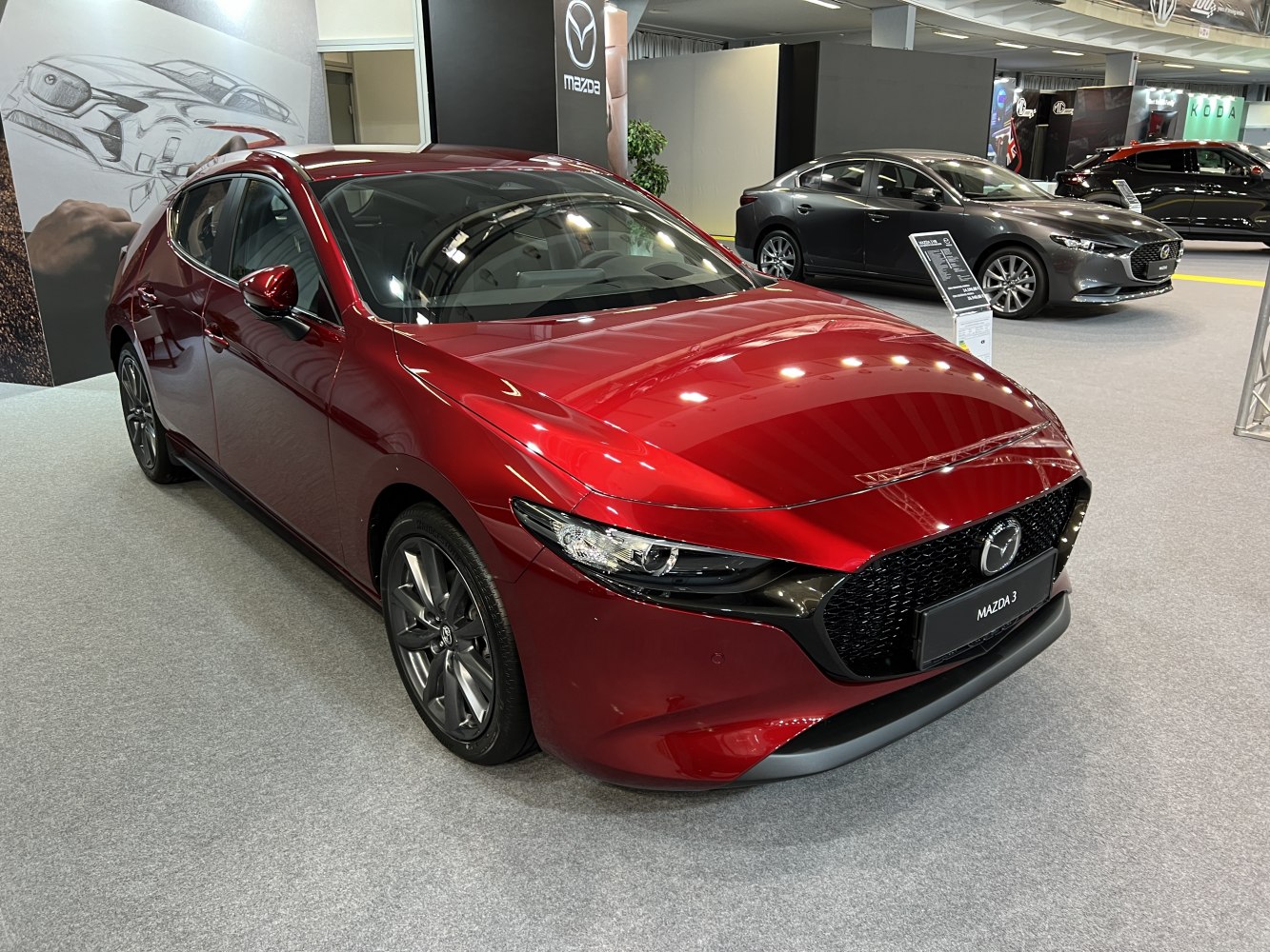 Sleek front design with grille and sharp headlights