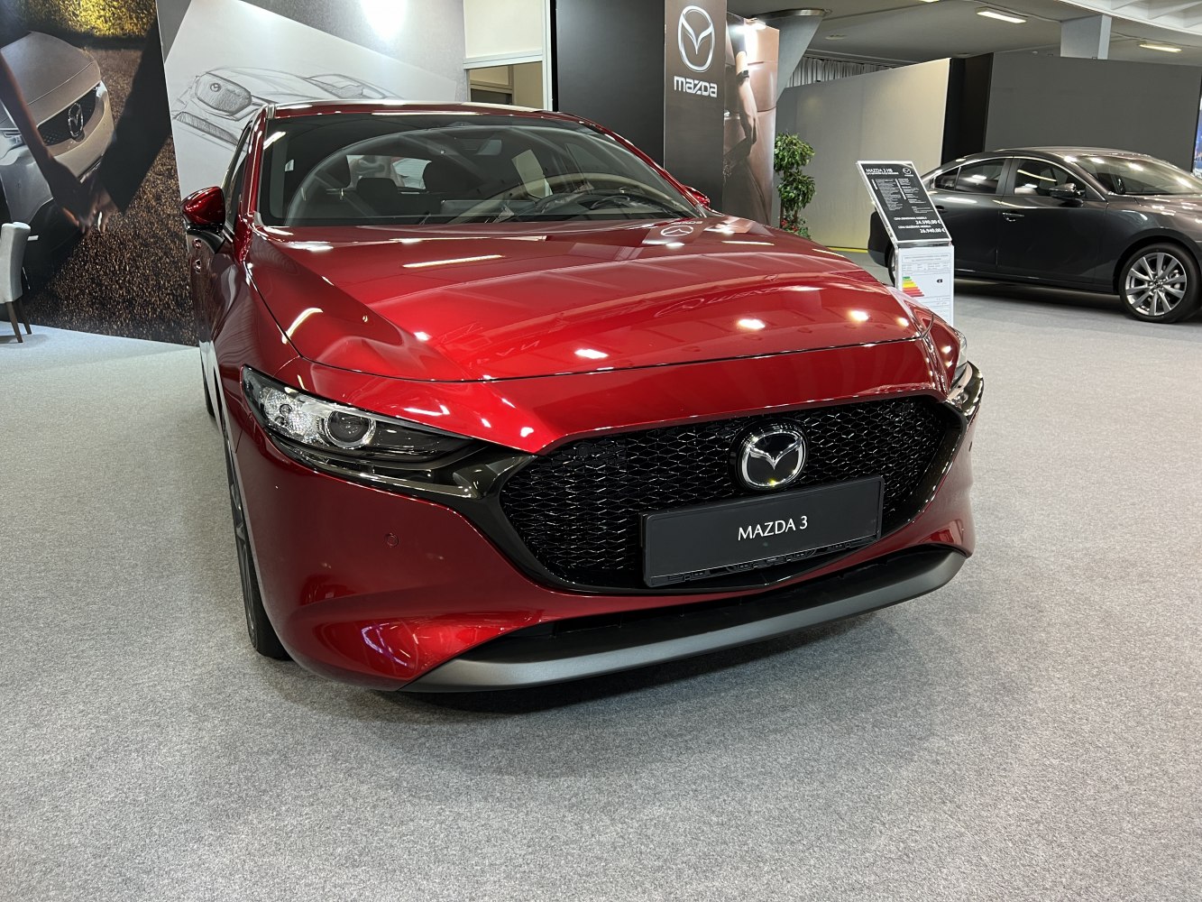 Sleek front grille and headlights of a modern hatchback car