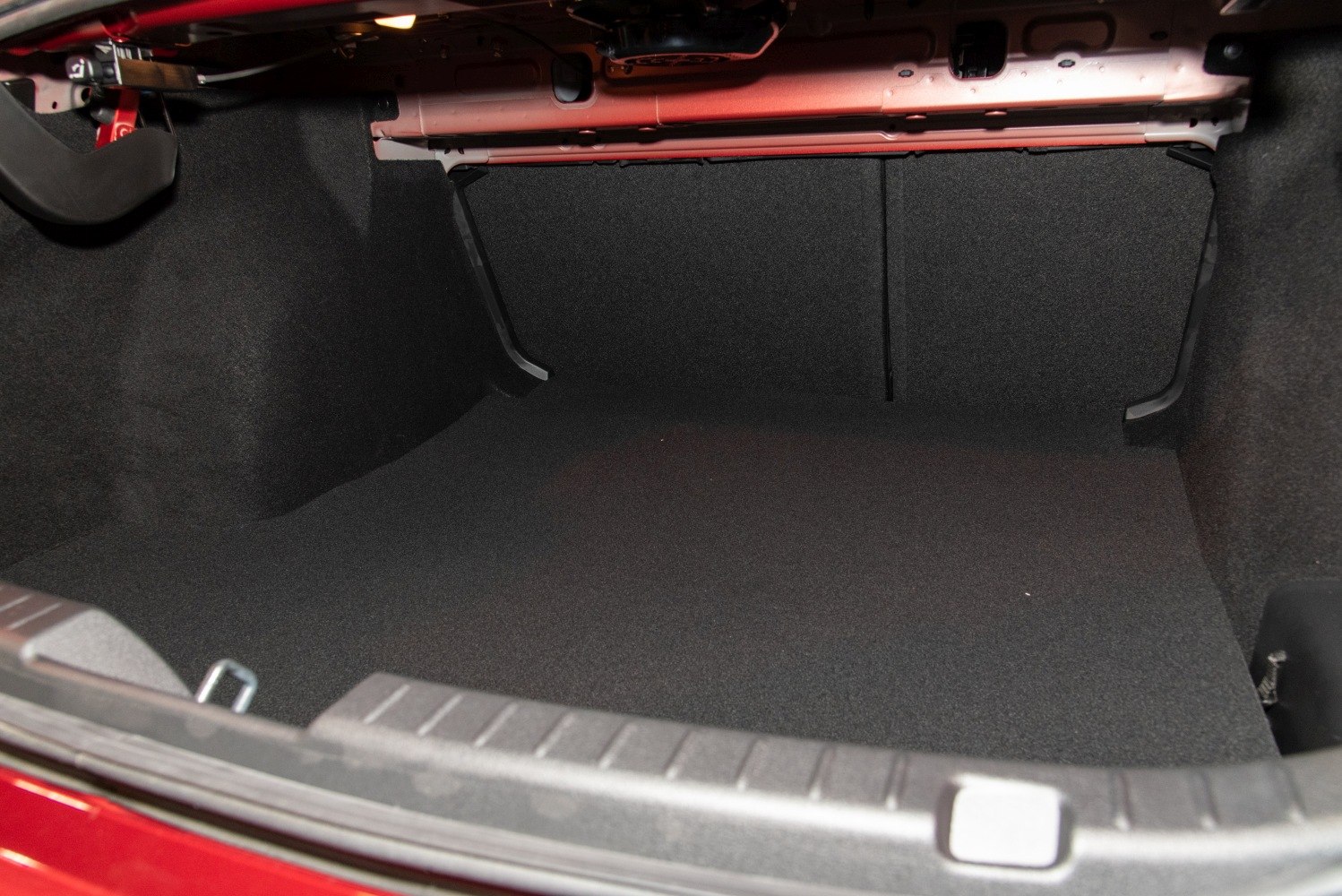 Spacious, practical sedan trunk interior with clean, carpeted surfaces.