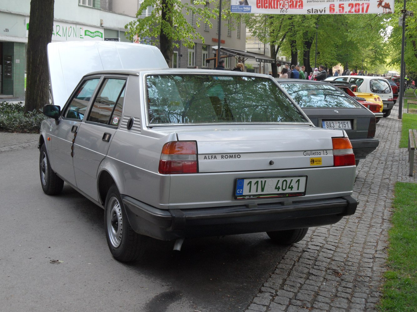 Boxy sedan rear view with rectangular tail lights and rear badging
