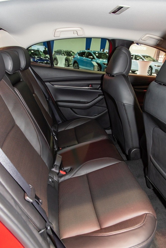 Rear passenger seating with leather and fabric upholstery