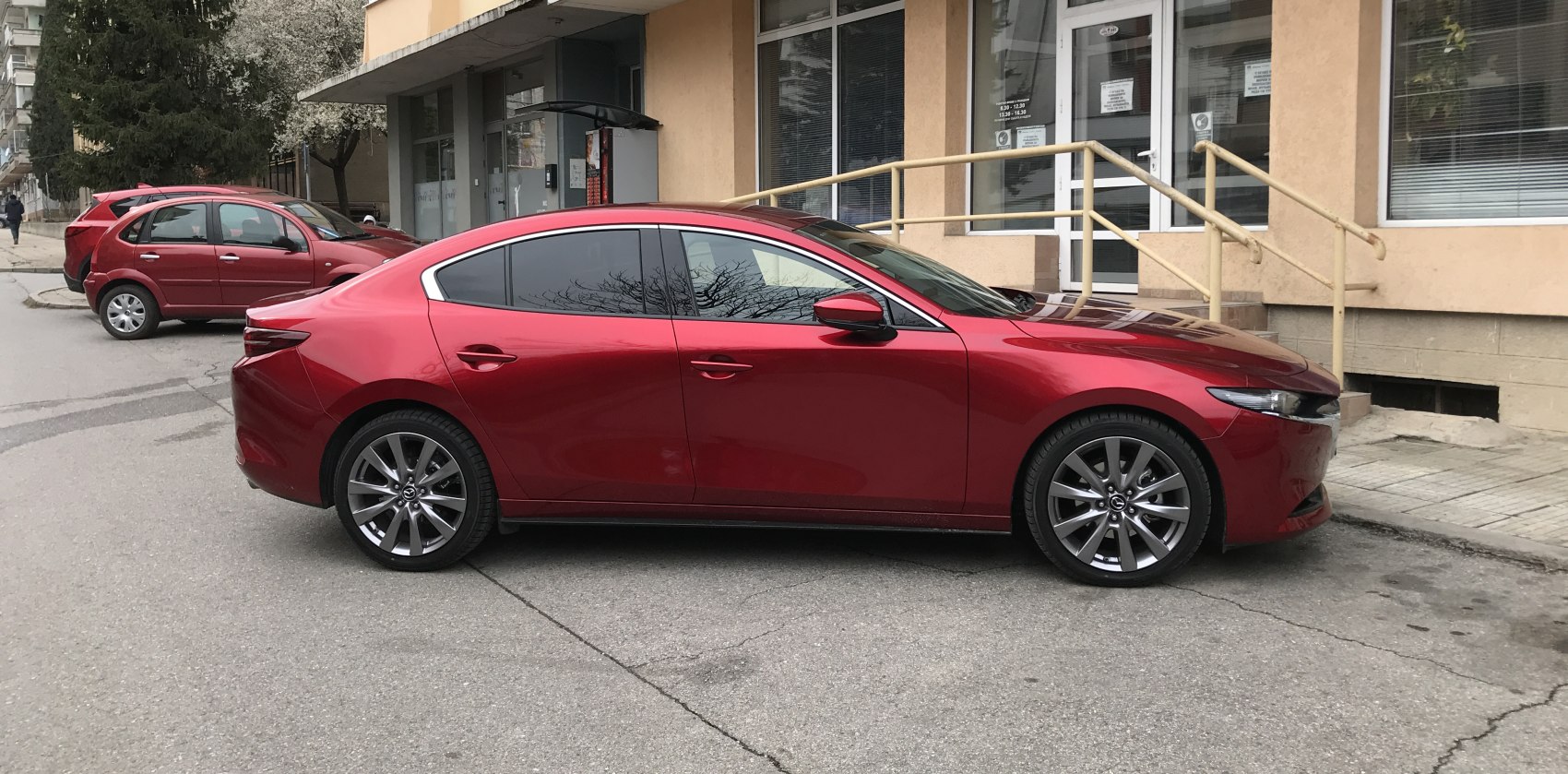 Sleek 4-door sedan with sporty alloy wheels and modern headlights