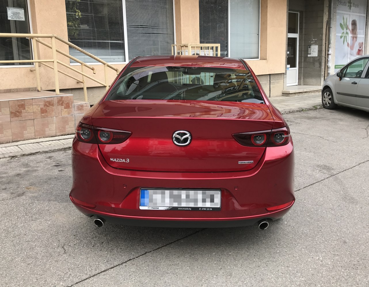 Rear view with dual exhaust and circular tail lights