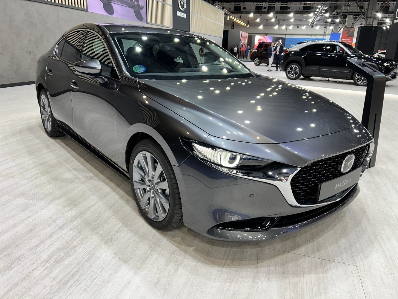 Front-side view with sleek headlights and aerodynamic body