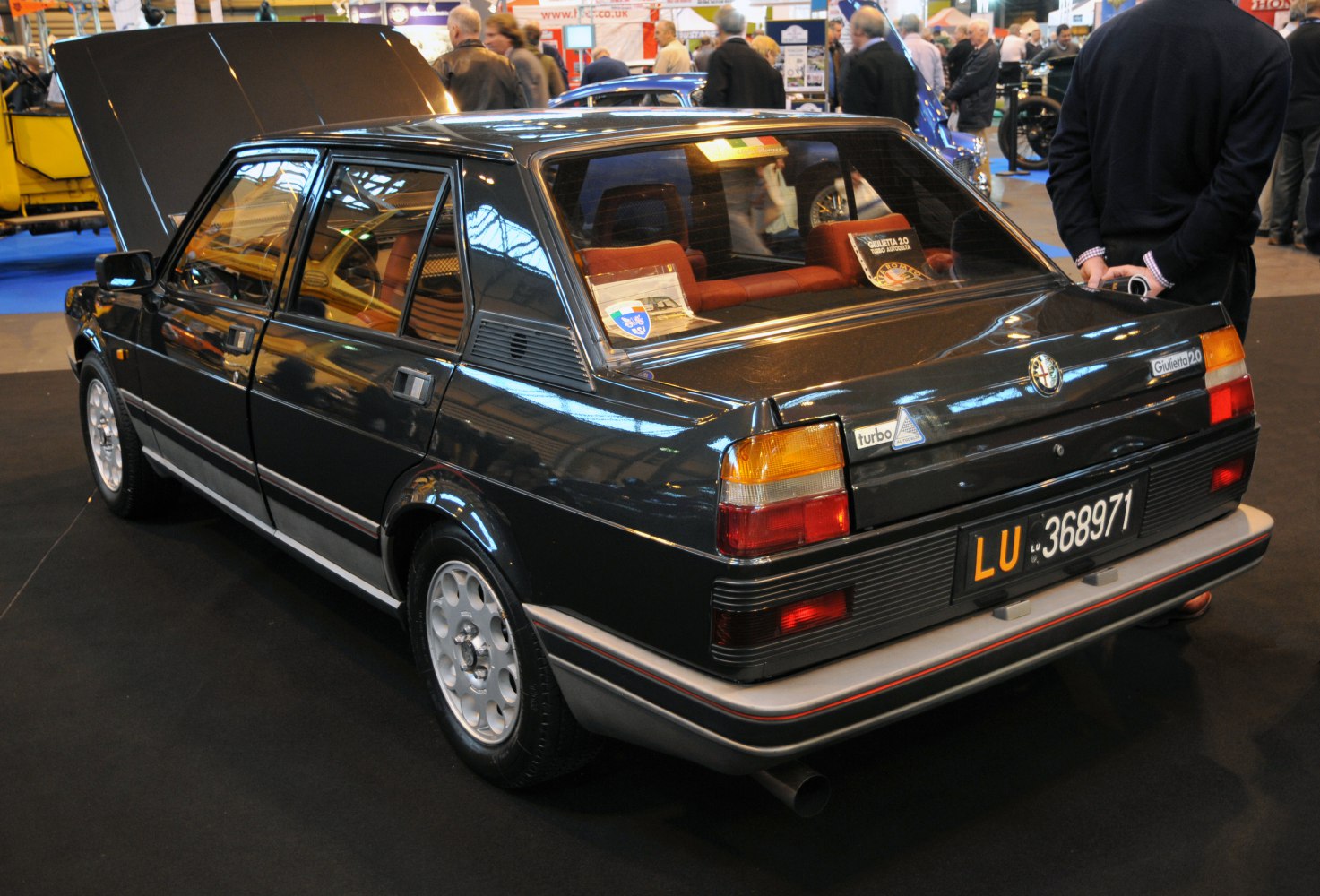 Rear and side view of classic hatchback with vintage taillights and turbo badge