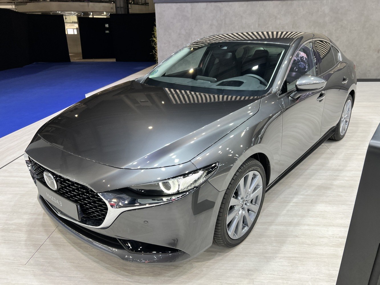 Sleek front grille and sharp LED headlights with sporty design.