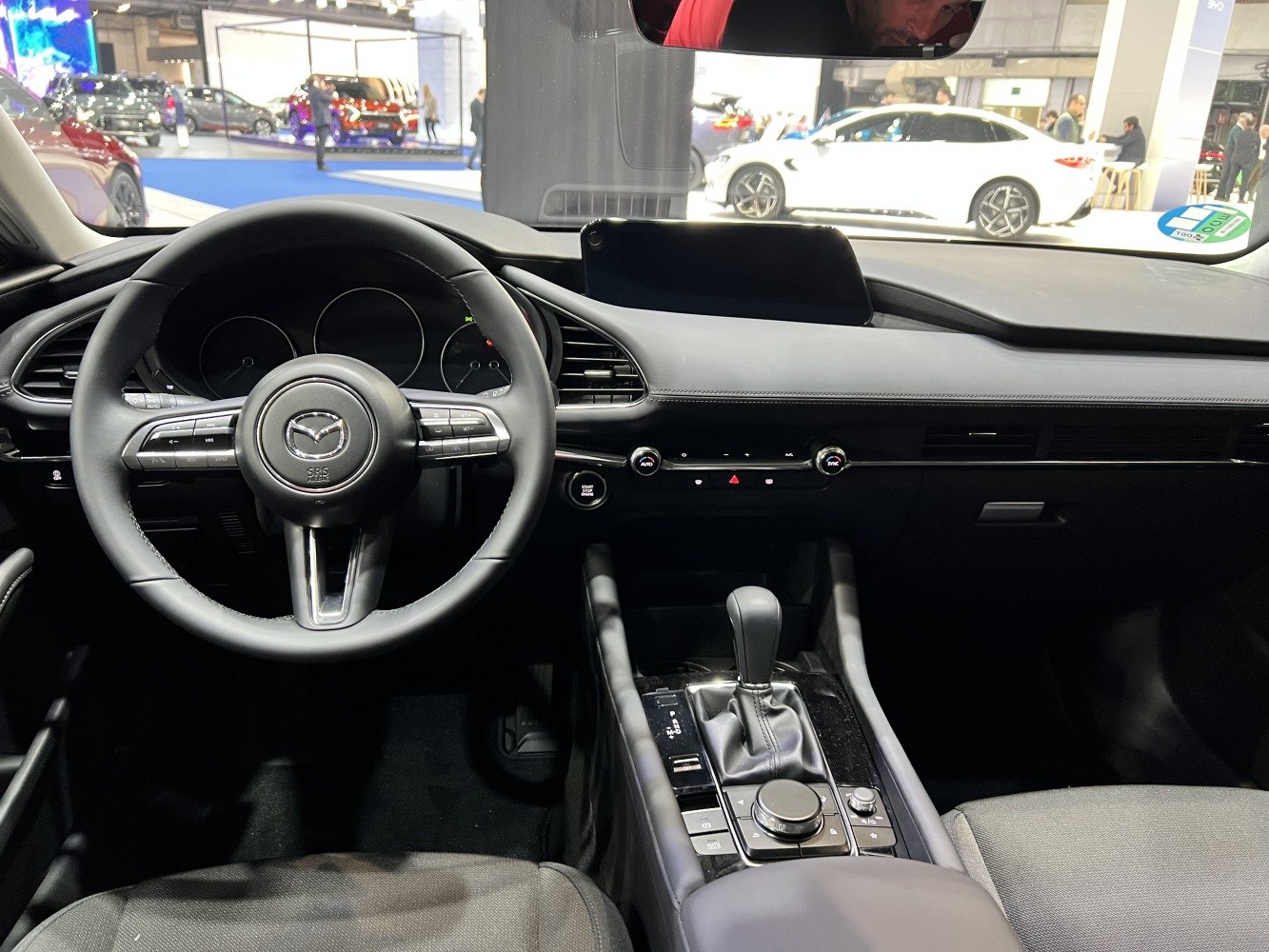 Steering wheel, dashboard, and center console with infotainment controls