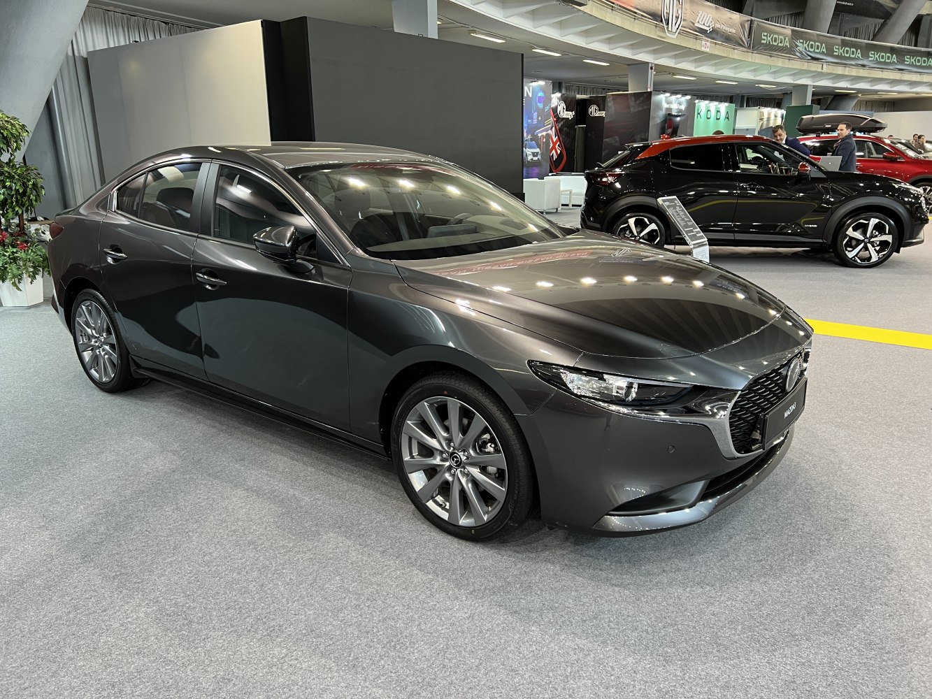 Modern sedan with LED headlights and alloy wheels