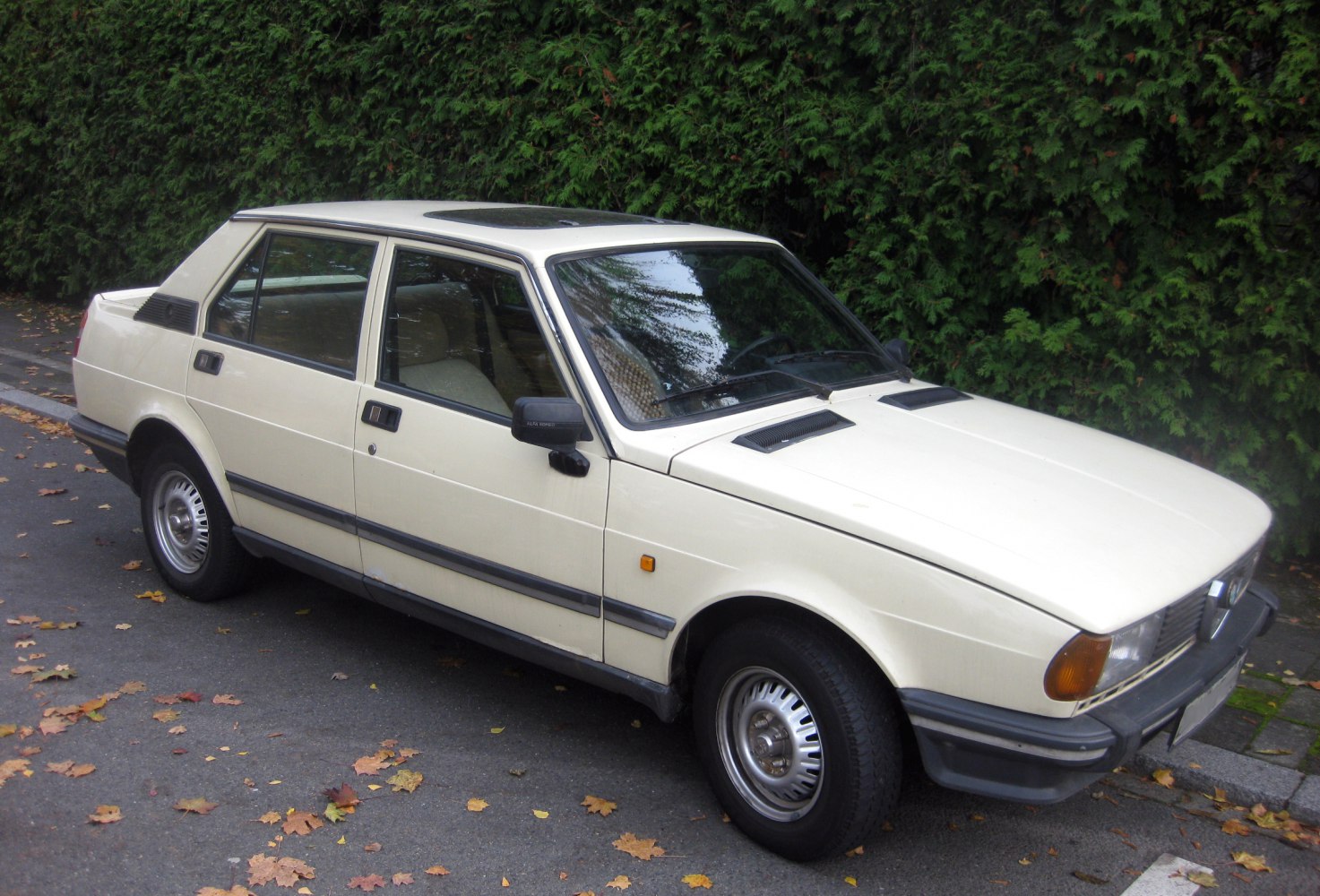 Boxy sedan with hatchback rear and sunroof