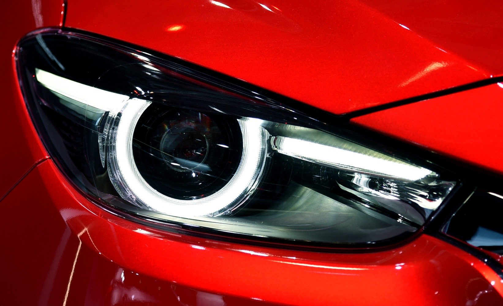 Close-up of LED headlight with circular daytime running light