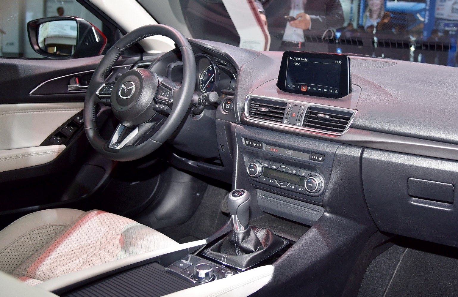 Interior dashboard with manual gearshift and infotainment screen