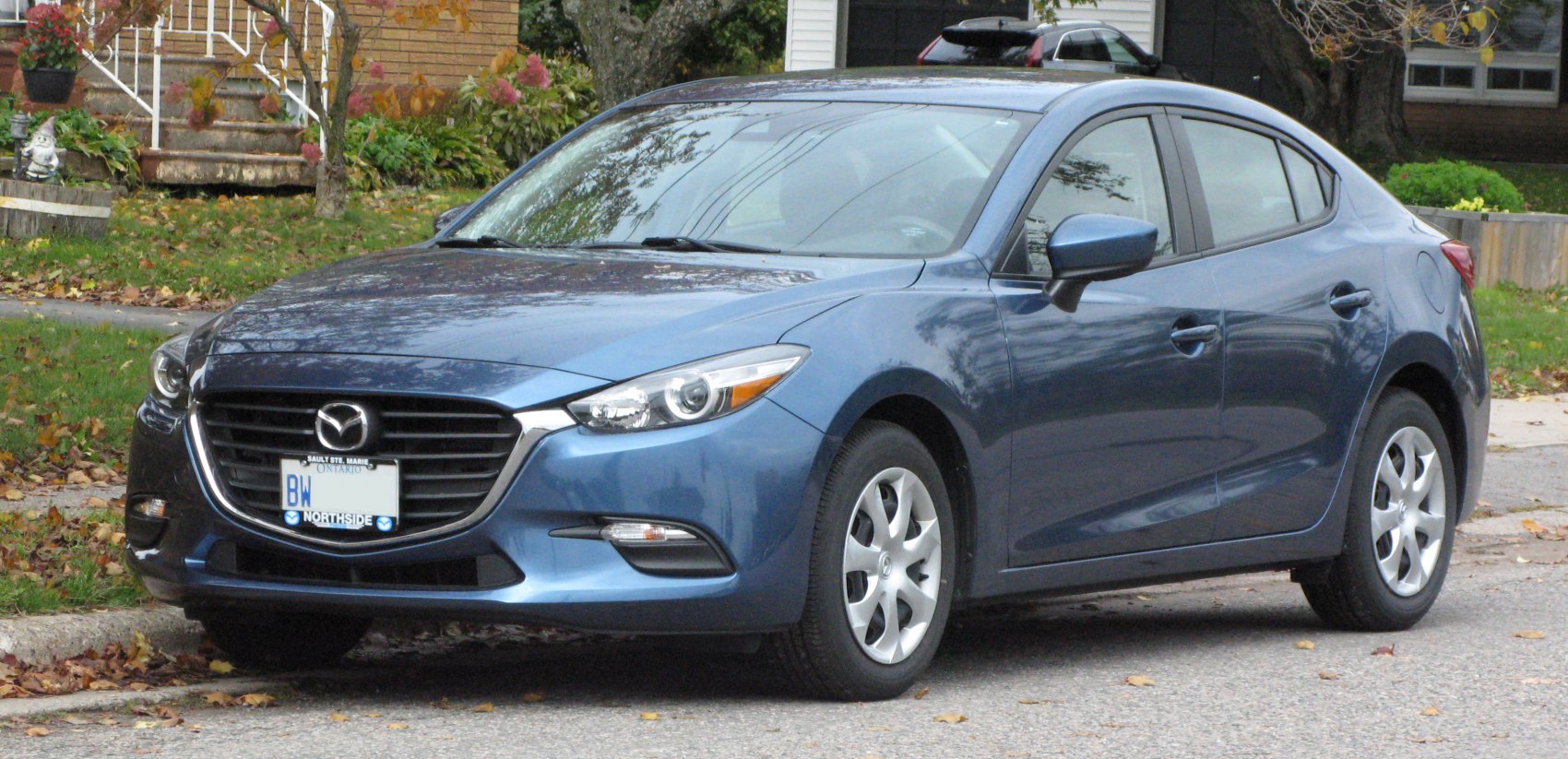 Front view with sleek headlights and grille of a modern sedan