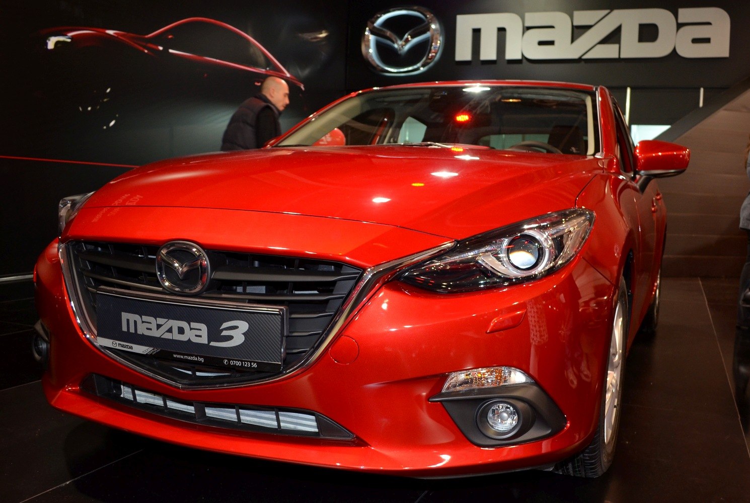 Close-up of car front grille and headlight with fog light