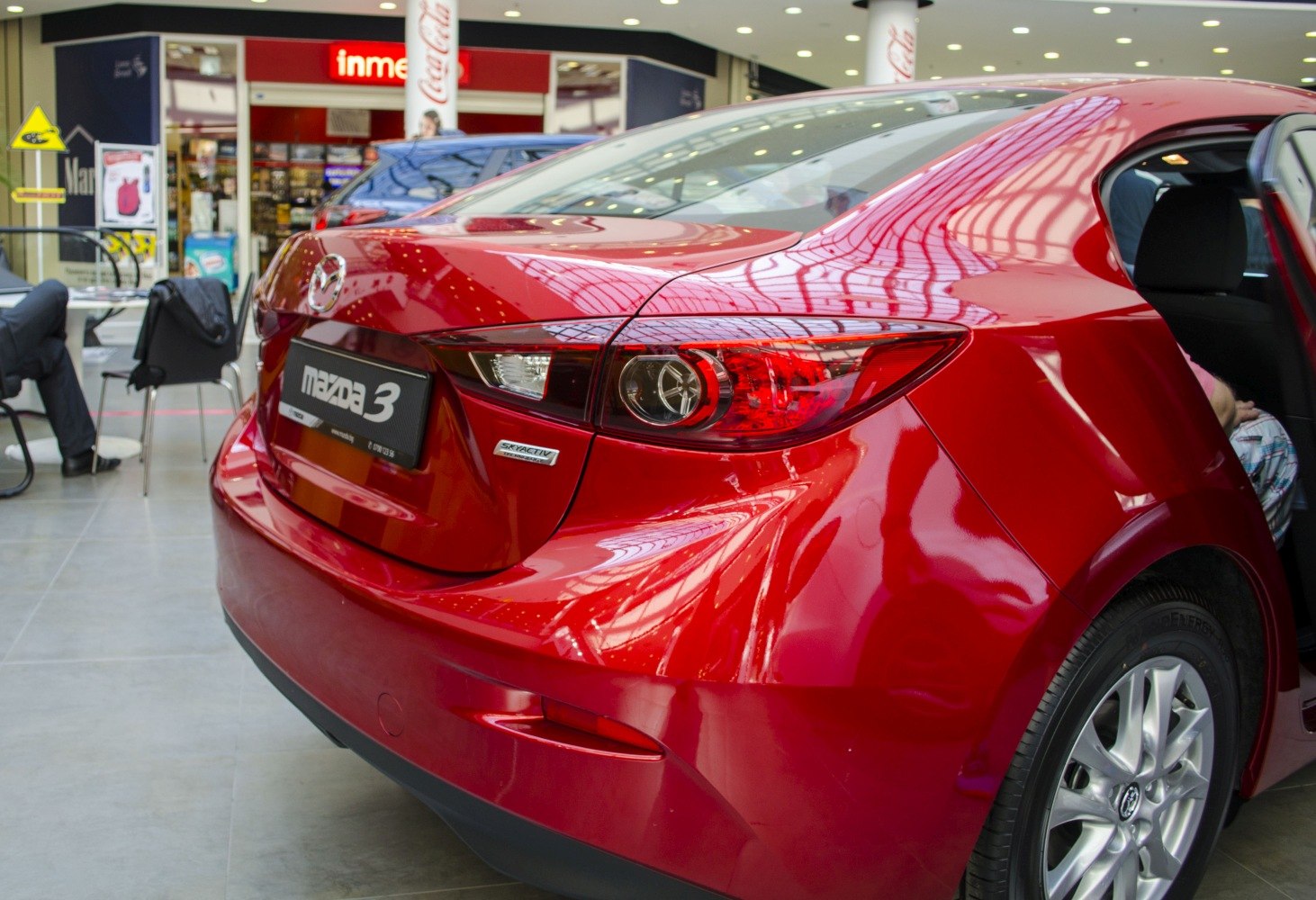 Rear end with distinctive taillight and Skyactiv badge in red paint