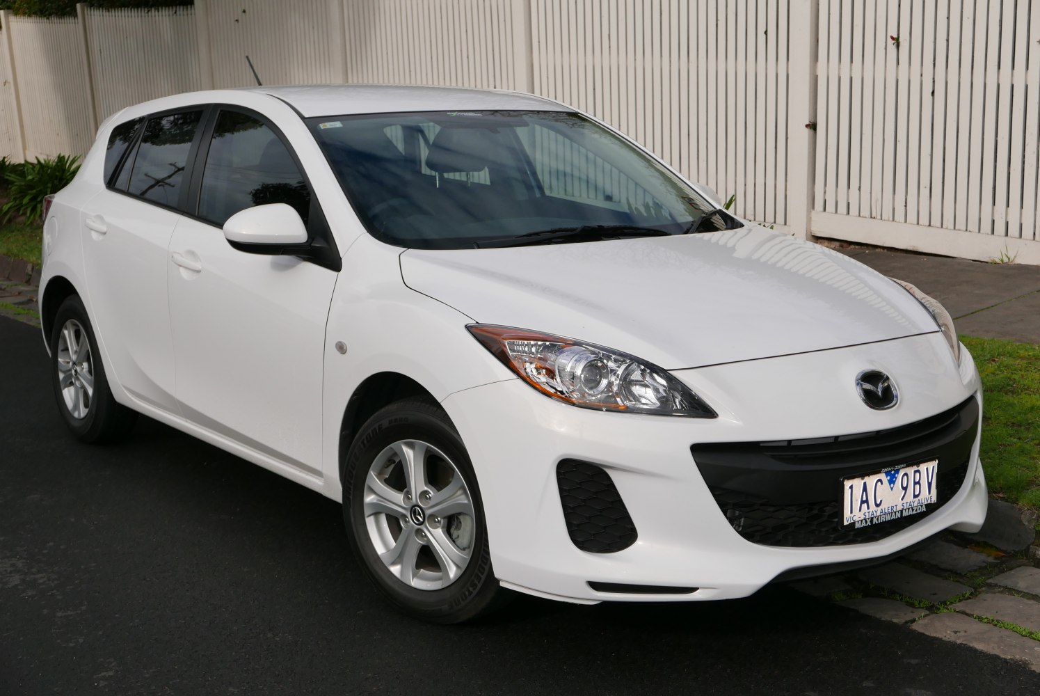 Front side view of compact hatchback with aerodynamic headlights
