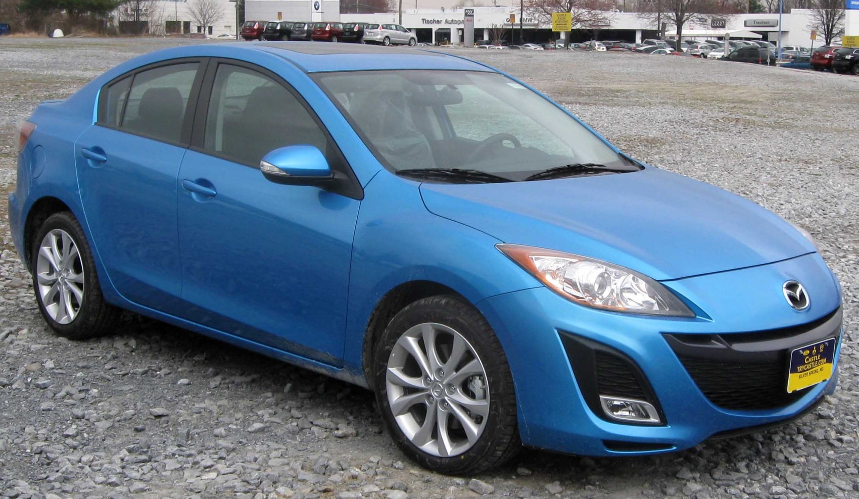 Front view of blue sedan with alloy wheels