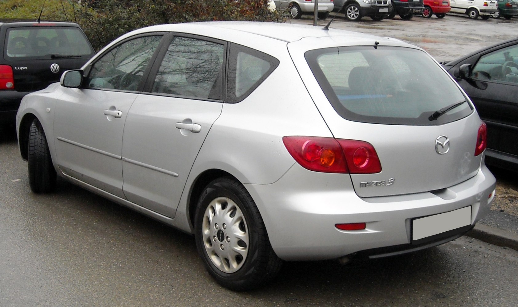 Rear and side view of a compact hatchback with distinctive taillights.