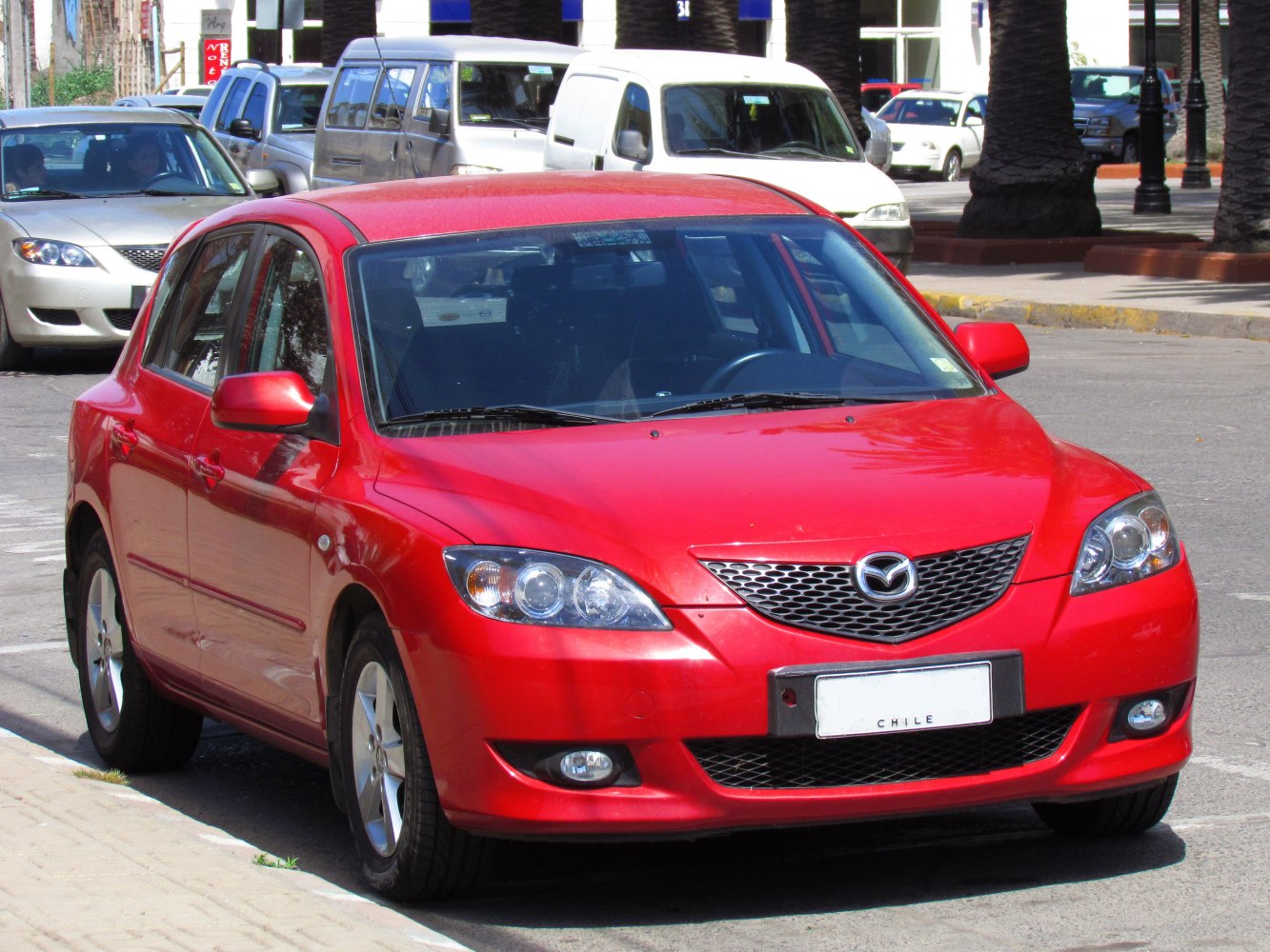 Front view hatchback with rounded headlights and mesh grille