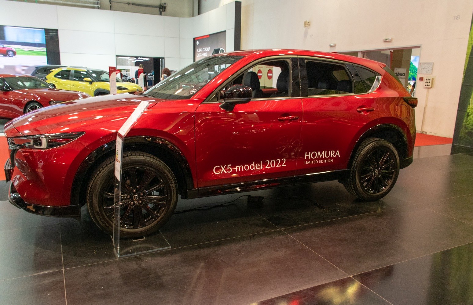 Red SUV with black rims and Homura Limited Edition branding
