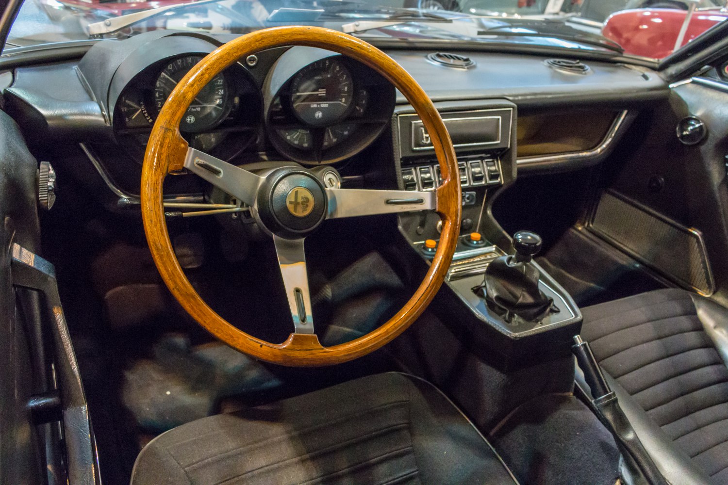Wooden steering wheel and vintage dashboard with manual gear shift