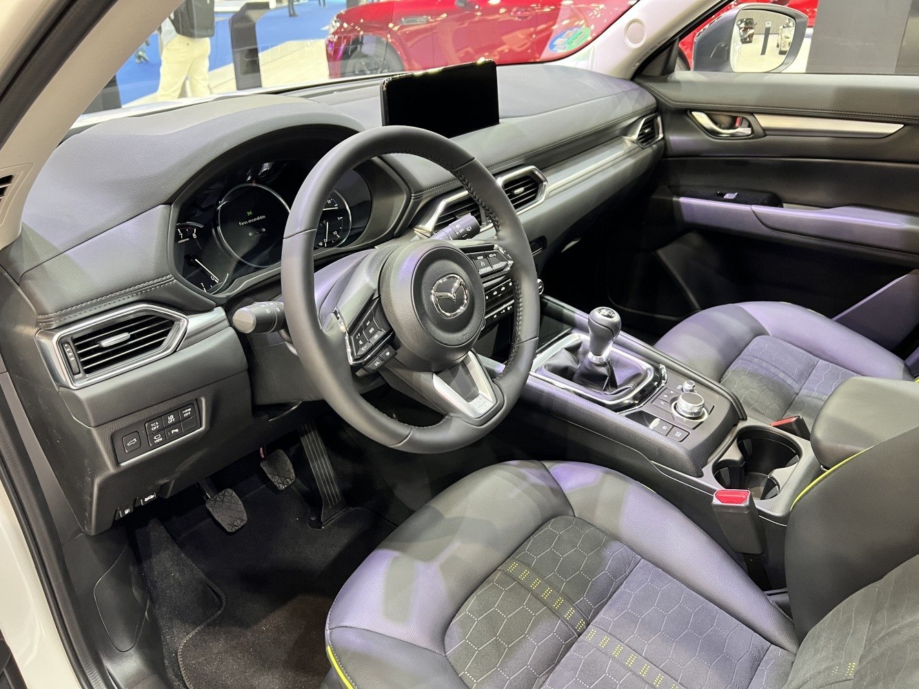 Interior with steering wheel and manual gear shift