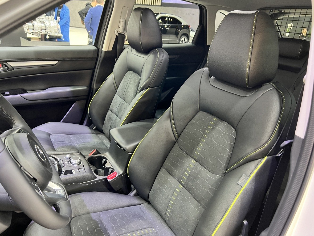 Premium front interior seats with detailed stitching and ergonomic design
