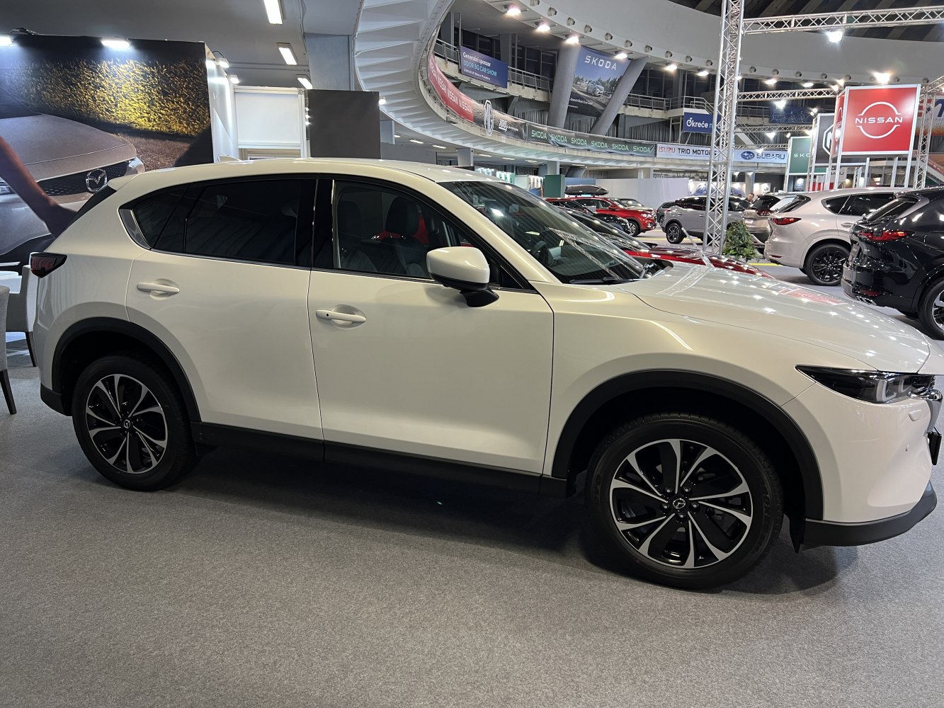 White SUV side profile with modern alloy wheels and aerodynamic design