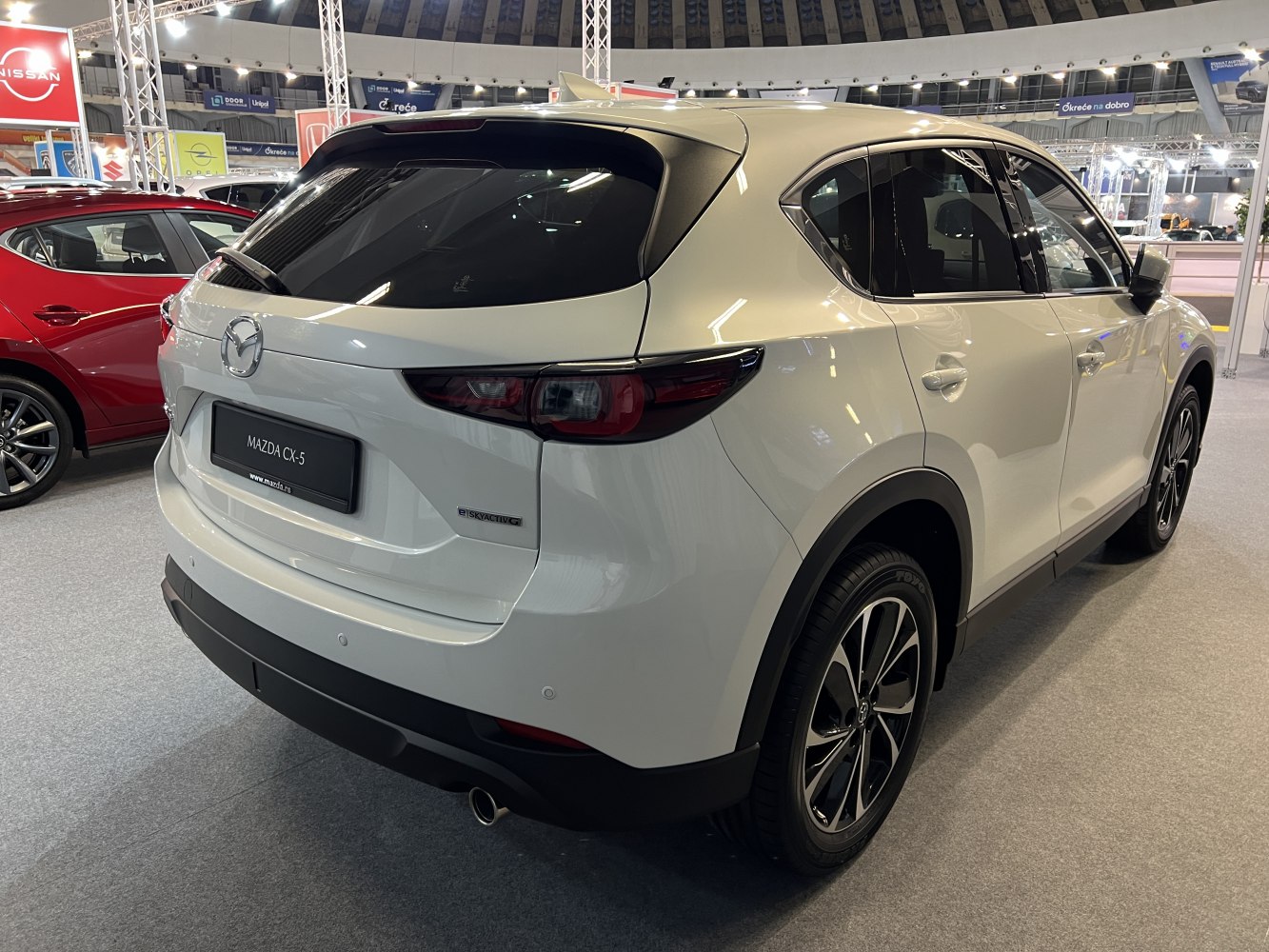 Rear and side view of a modern SUV with sleek tail lights and alloy wheels