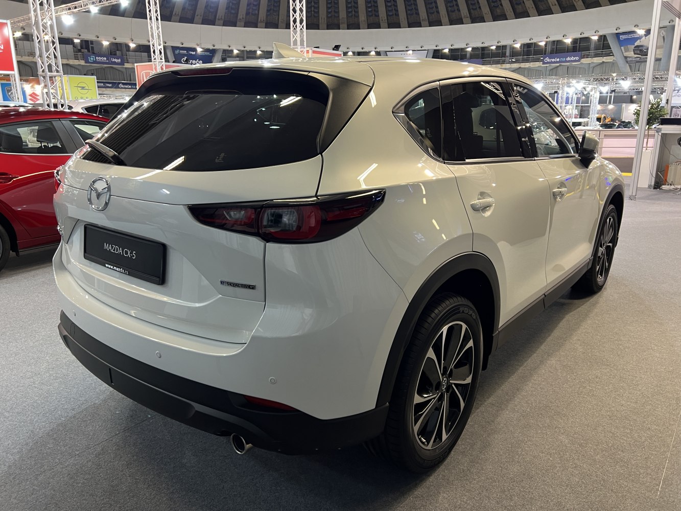 Rear and side view of a modern SUV showing sleek taillights and alloy wheels