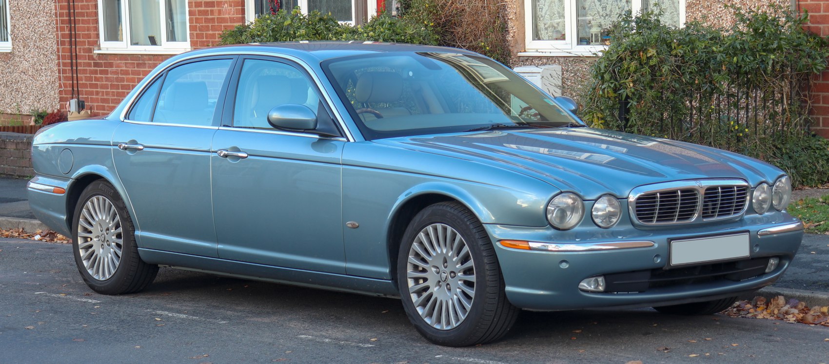 Classic sedan with rounded dual headlights and polished chrome grille