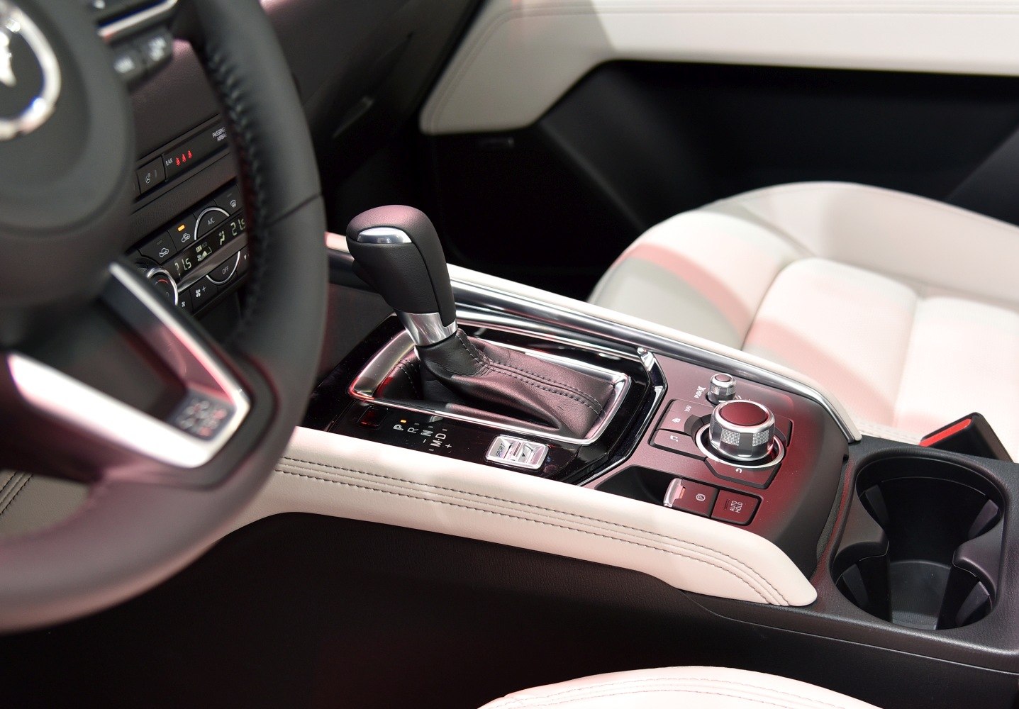 Gear shift lever and central control dial in car interior