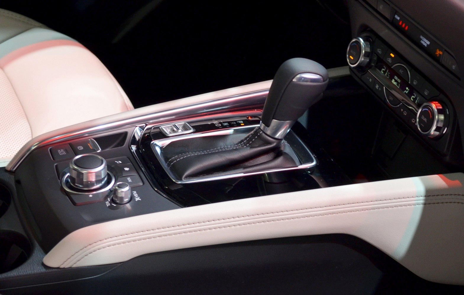 Close-up of gear shift lever and multimedia control panel in car center console