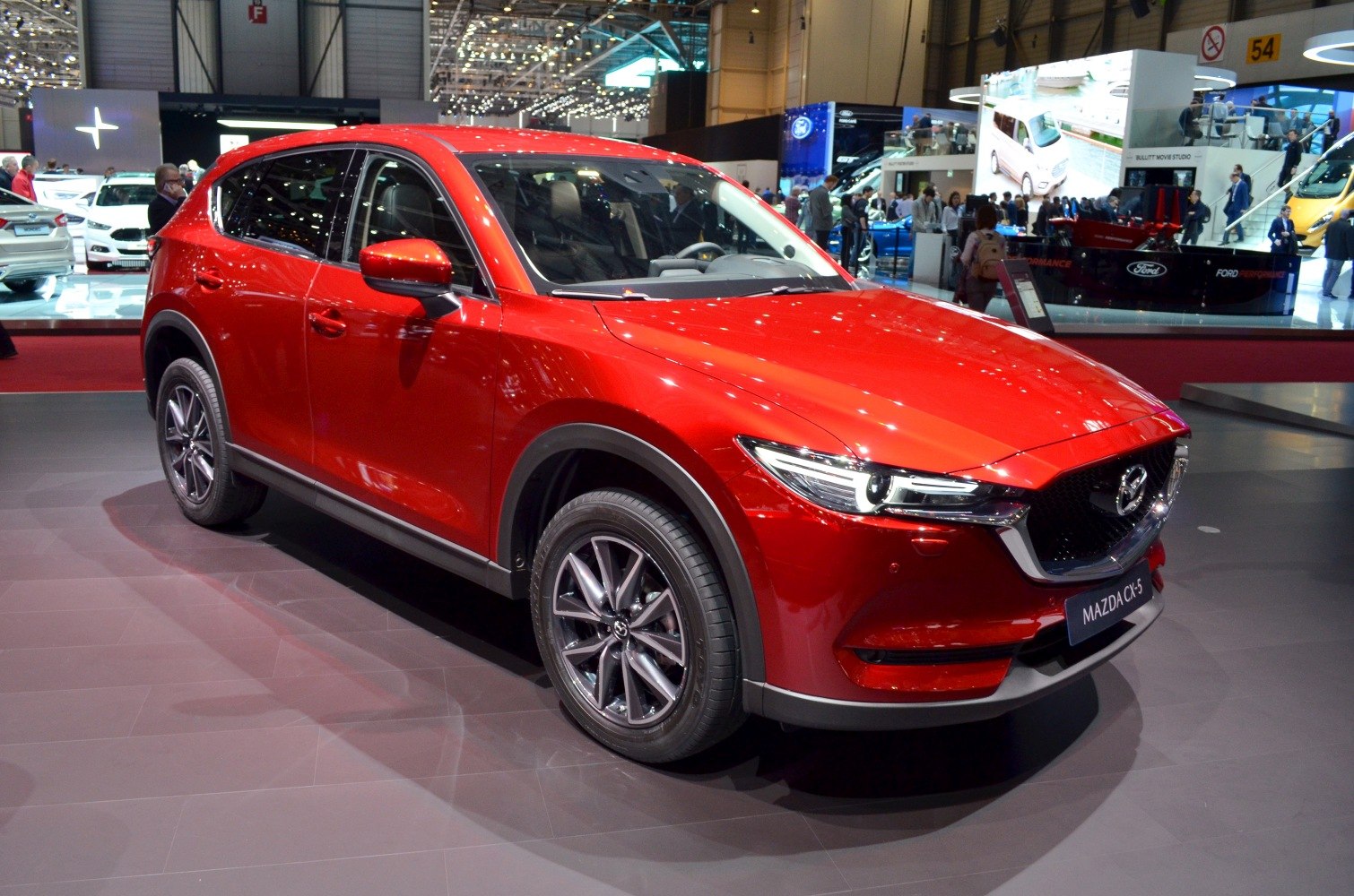 Red SUV front three-quarter view with LED headlights and alloy wheels