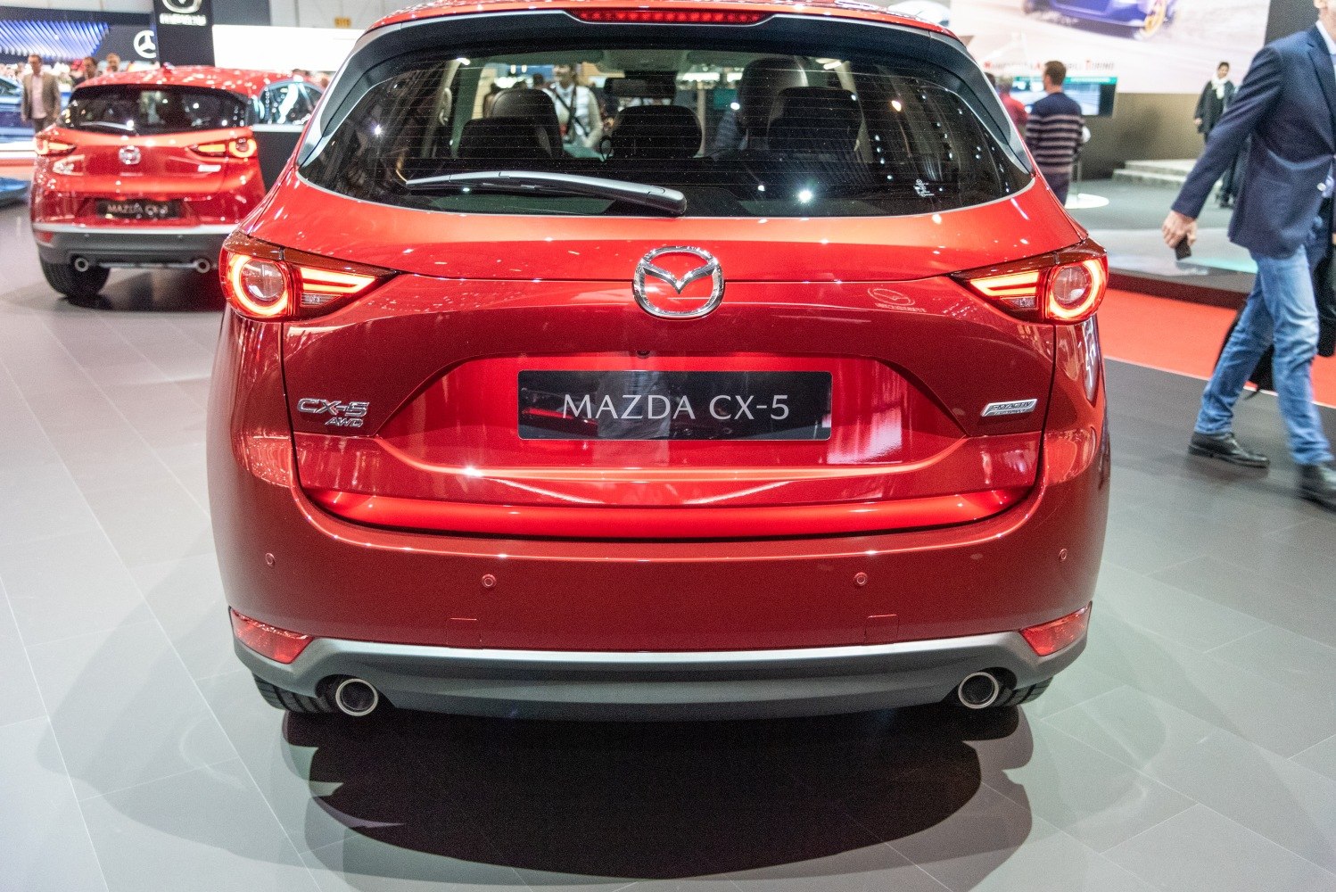 Rear view with distinctive tail lights and dual exhaust pipes