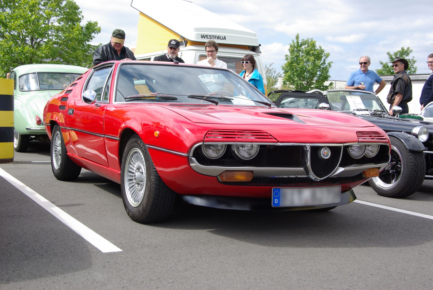 Vintage sports coupe with quad headlights and distinctive front grille