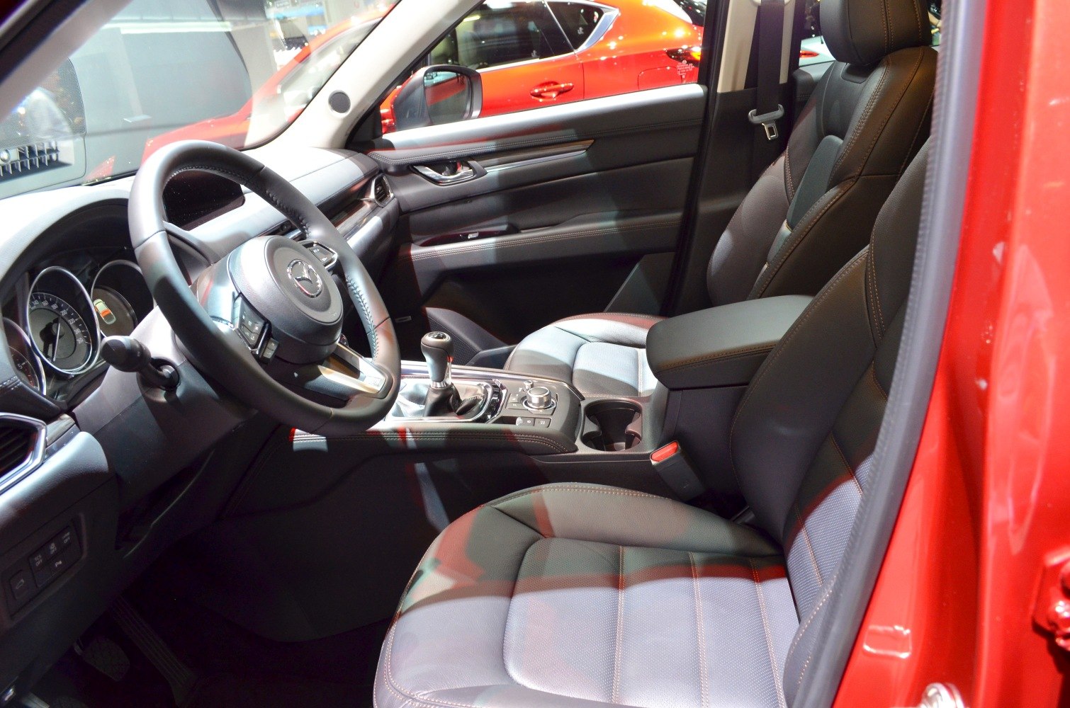 Leather front seats with modern dashboard and center console.