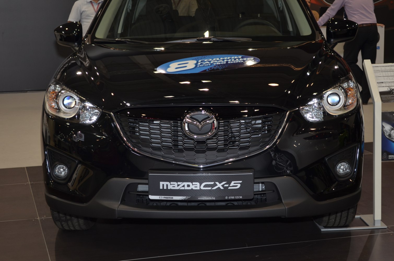 Front grille with Mazda emblem, headlights, and fog lights