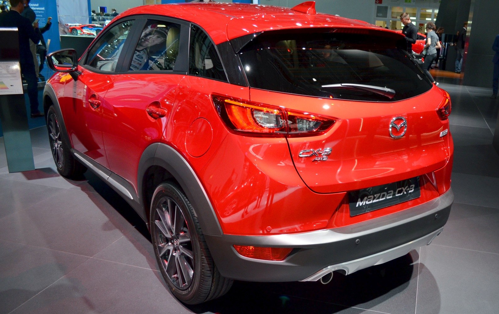Rear and side view with distinct taillights and bumper