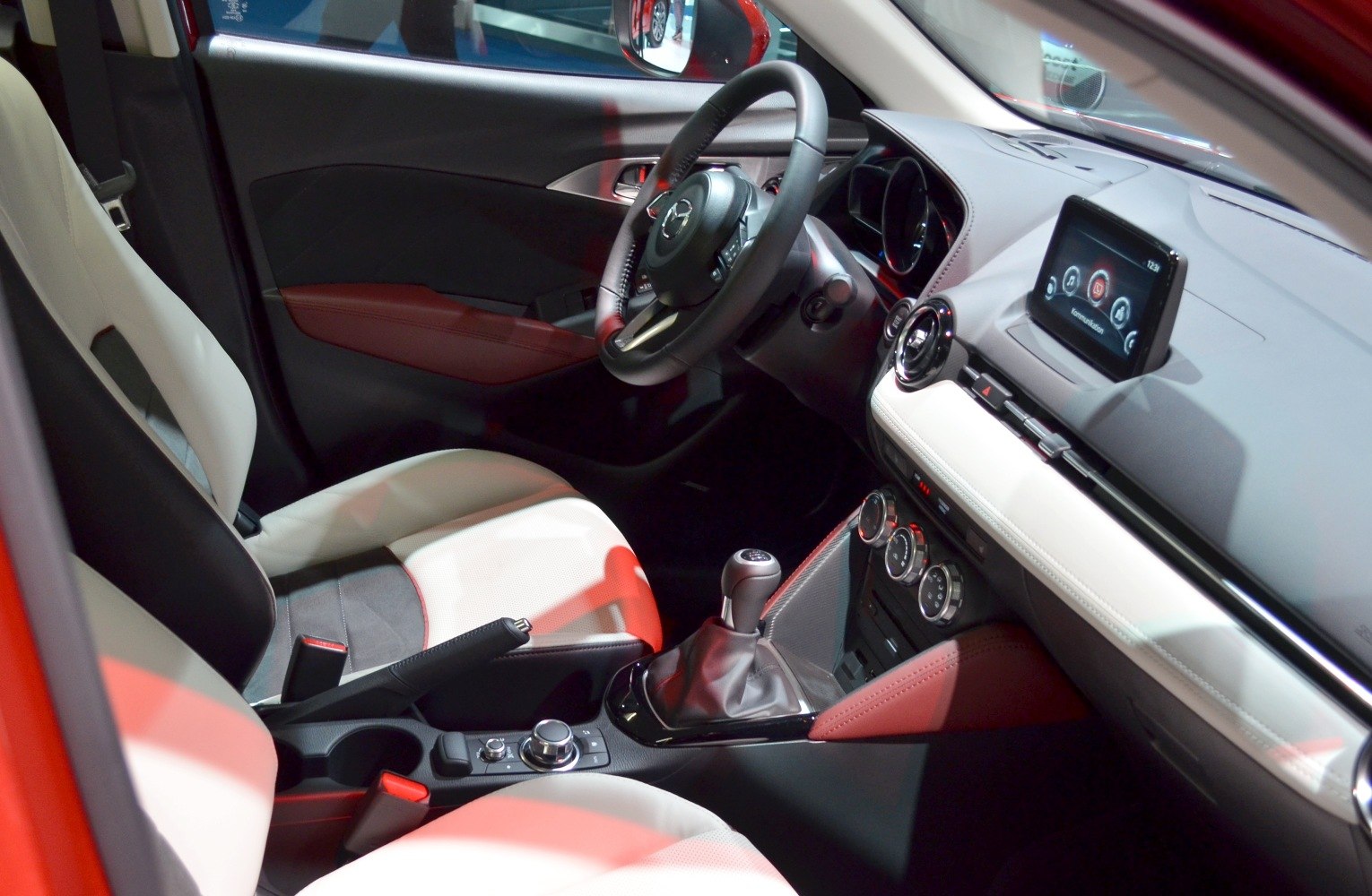 Interior with manual gearbox, infotainment screen, and modern dashboard design