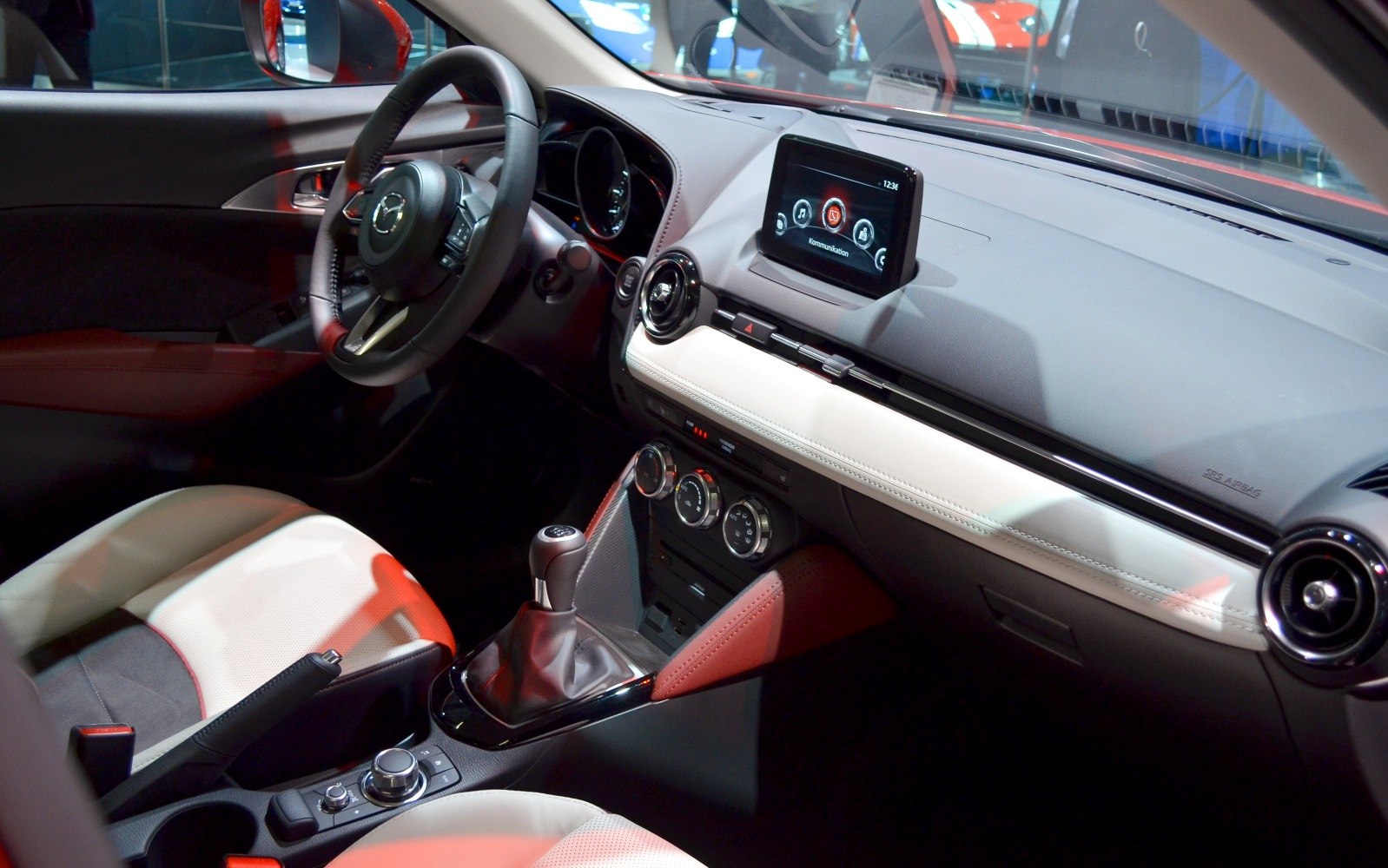 Car interior dashboard with infotainment system and manual gear shift