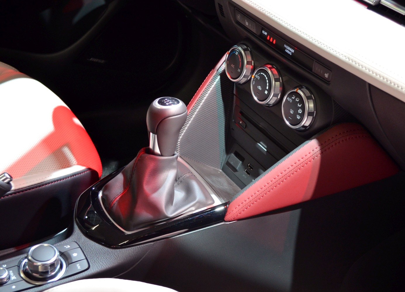 Manual gear shift lever and climate control knobs in car interior